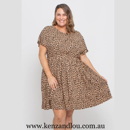 Unleash your wild side in our Camel Leopard dress crafted from luxurious polyester fabric. Embrace the fierce allure of leopard print while enjoying the comfort and style. Available in sizes 16-22, this dress is designed to accentuate your curves, making a bold statement in every stride. Dress up with confidence.