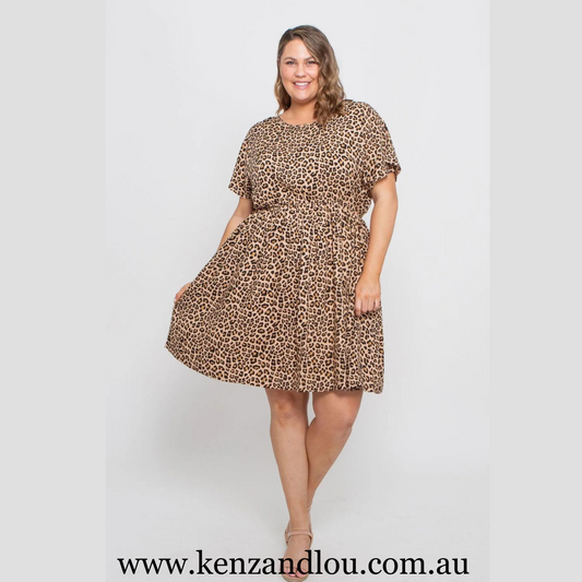 Unleash your wild side in our Camel Leopard dress crafted from luxurious polyester fabric. Embrace the fierce allure of leopard print while enjoying the comfort and style. Available in sizes 16-22, this dress is designed to accentuate your curves, making a bold statement in every stride. Dress up with confidence.