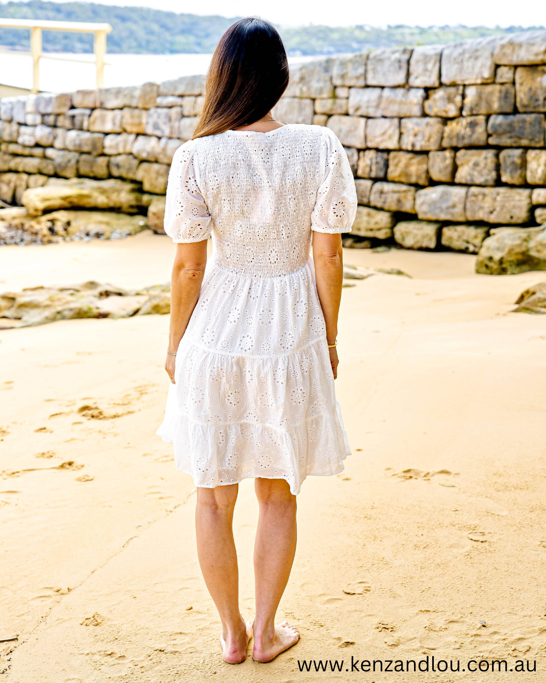 Back view White Boho Mini Dress Brodie Anglaise Cotton Dress Lined White Dress 100% Cotton Bohemian Style Cotton Dress Vintage Brodie Anglaise Mini Dress Chic White Boho Attire Feminine Cotton Dress with Anglaise Detail Stylish Bohemian White Dress Lace-Adorned Cotton Mini Dress Classic White Dress with Boho Flair