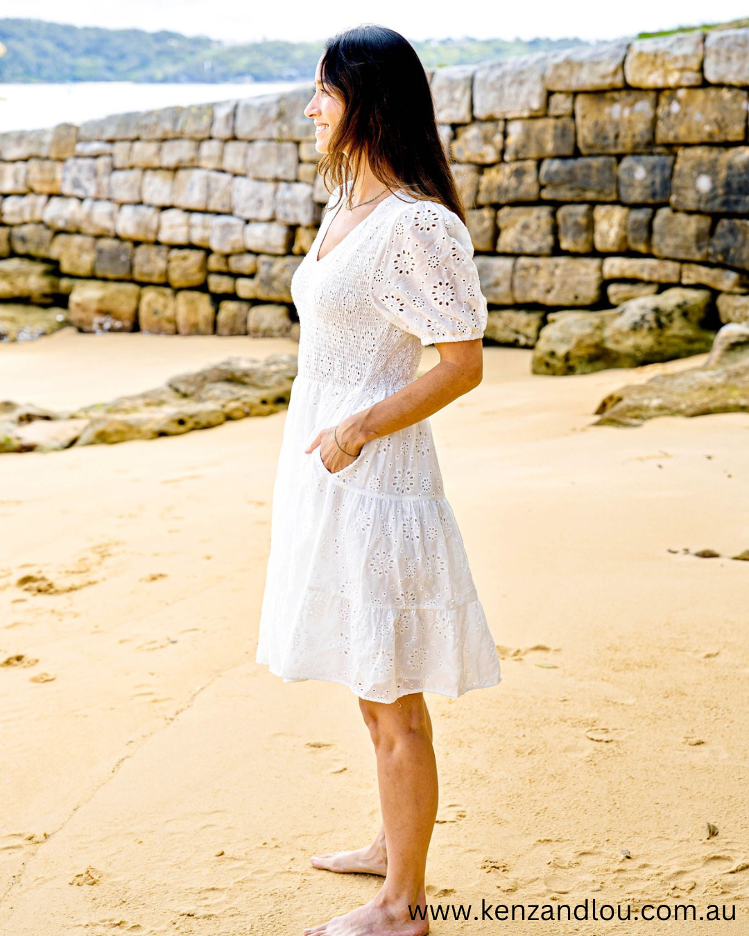 Side pocket view White Boho Mini Dress Brodie Anglaise Cotton Dress Lined White Dress 100% Cotton Bohemian Style Cotton Dress Vintage Brodie Anglaise Mini Dress Chic White Boho Attire Feminine Cotton Dress with Anglaise Detail Stylish Bohemian White Dress Lace-Adorned Cotton Mini Dress Classic White Dress with Boho Flair